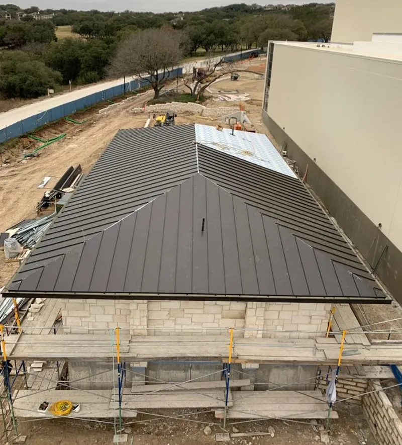 Metal roof new construction with scaffolding in Waterville